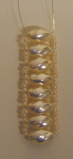 tessitura verticale intreccio ciondolo perline Croce di Nicole