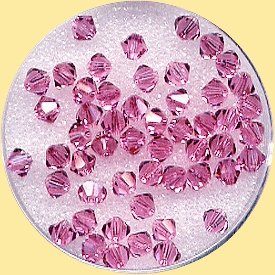 confezione rombetti cristalli Swarovski da 4 mm rosa fucsia