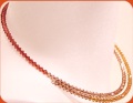 rosso aranciato ambra visone collana perline Swarovski cristalli rombetti su base armonica